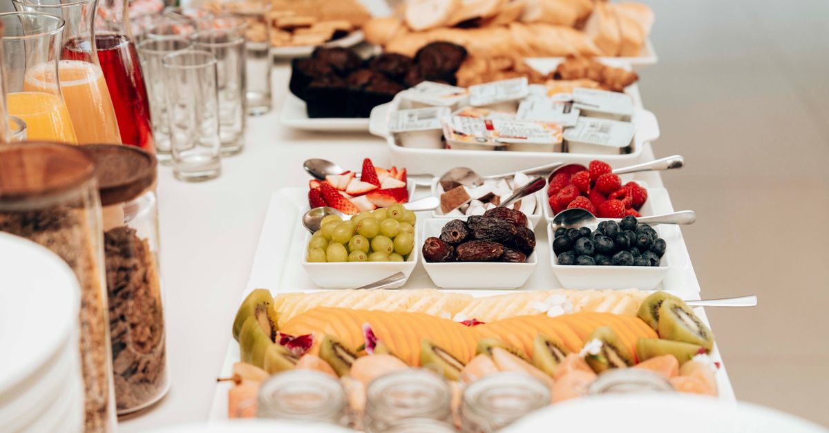 Colorful breakfast buffet featuring fresh fruits, pastries, and juices. Ideal for healthy and delicious morning meals.